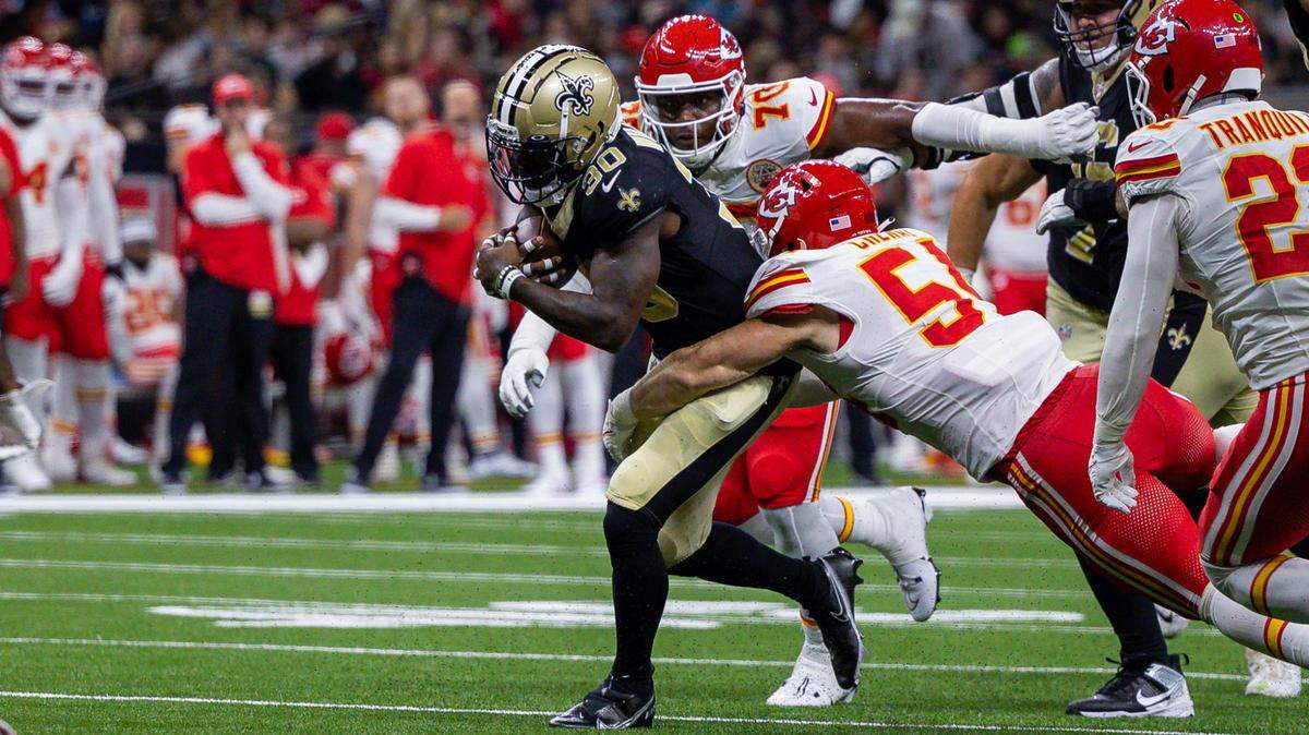 Kansas City Chiefs defensive end Mike Danna (No. 51) and defensive tackle Chris Williams bring down New Orleans Saints running back Jamaal Williams during Sunday’s NFL preseason opener at the Superdome in New Orleans.