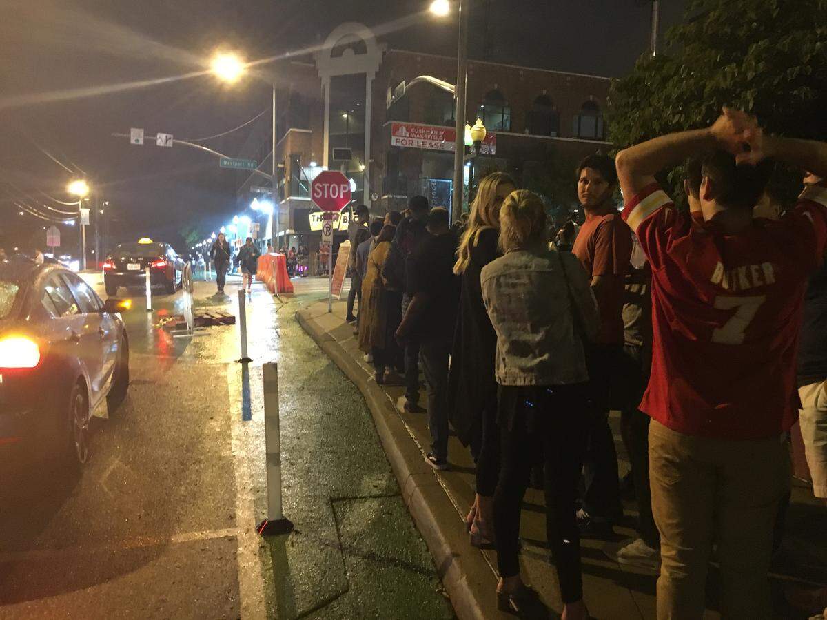 Dozens of people lined up along Mill Street after midnight Saturday, Sept. 8, 2018, as they waited to get through security and into Westport’s bars and clubs in Kansas City.