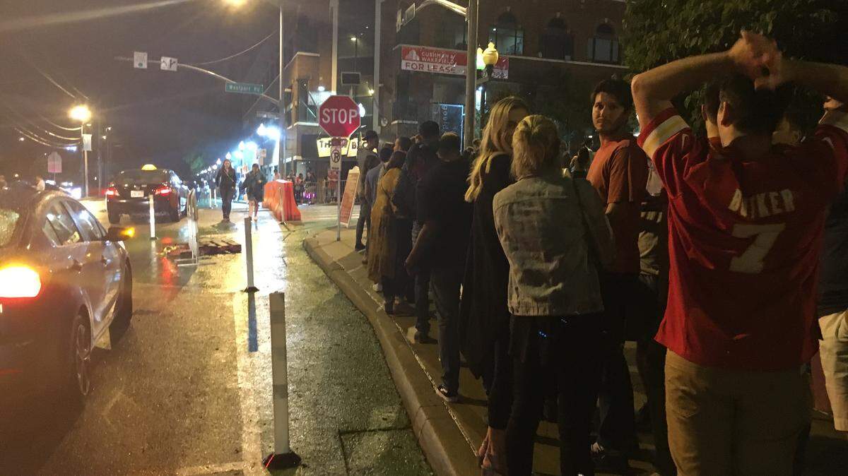 In this file photo, dozens of people line up along Mill Street to go through Westport security and head to the bars.