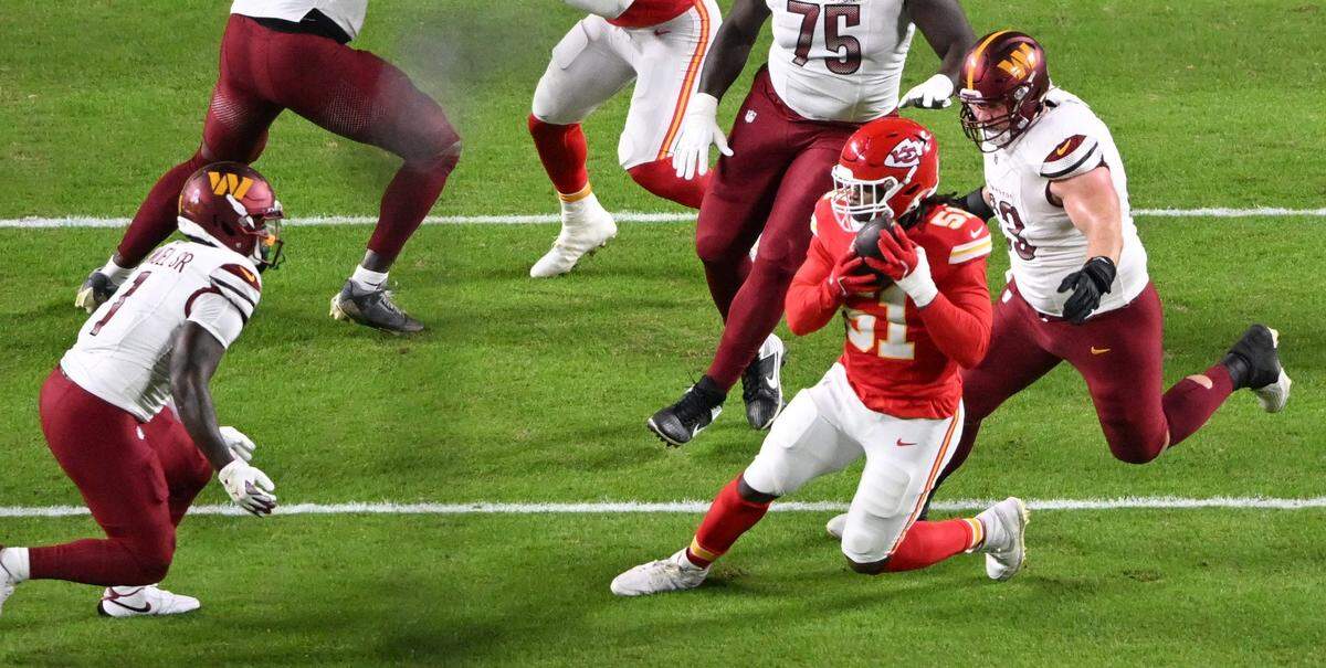Kansas City Chiefs defensive end Mike Danna (51) intercepts a pass after it bounced off Washington Commanders wide receiver Deebo Samuel (1) in the first quarter on Monday, Oct. 27, 2025, at GEHA Field at Arrowhead Stadium.