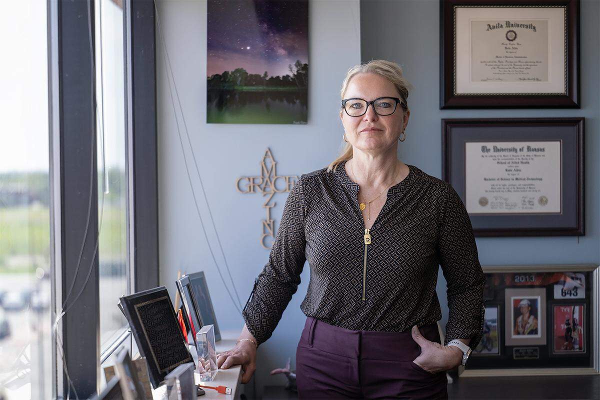 Katie Aldis, 54, a Major in the Army Reserves and a healthcare worker, reported to police that she was sexually assaulted during a massage at Om Grown Yoga Studio in Baldwin City, Kansas. She spoke about the assault Monday, May 4, 2026, in Olathe. 