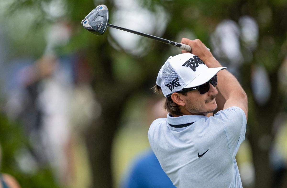 Garett Reband of York, S.C., watches his shot as he follows though on the 10th hole in the first round of the AdventHealth Championship on Thursday, May 16, 2024, at Blue Hills Country Club in Kansas City.