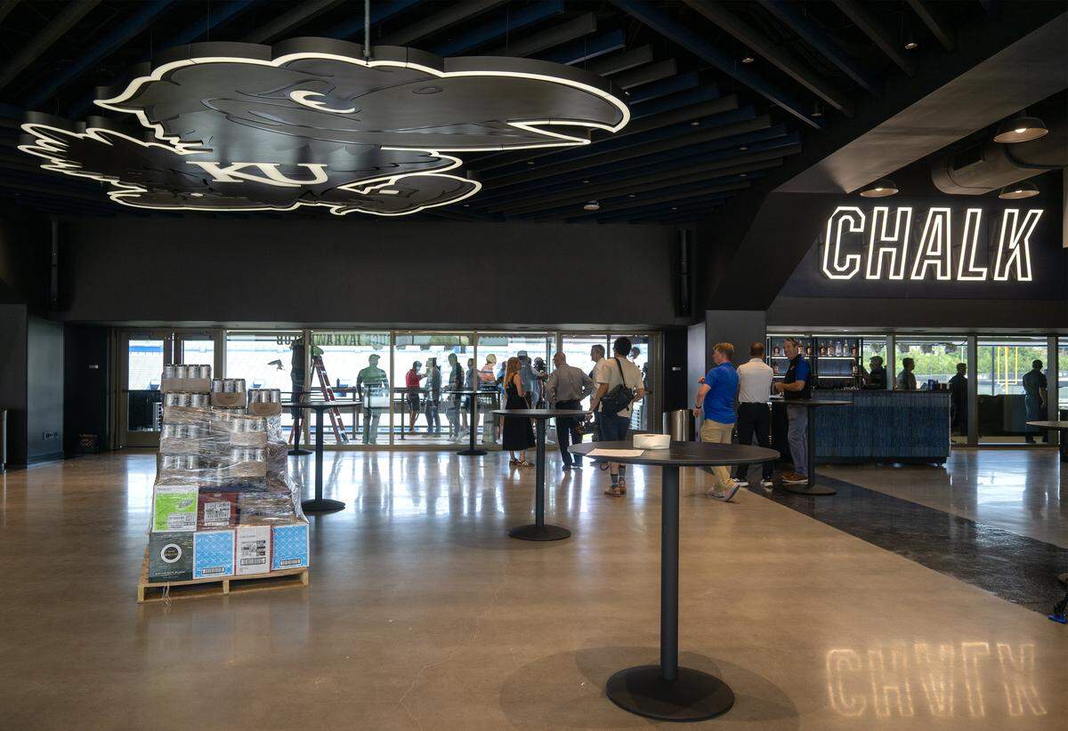An oversized Jayhawk is seen on the ceiling inside at the renovated David Booth Kansas Memorial Stadium. The giant emblem is at the entrance to the Jayhawk Club which will serve as the players’ fuyeling station and premium space on gamedays.