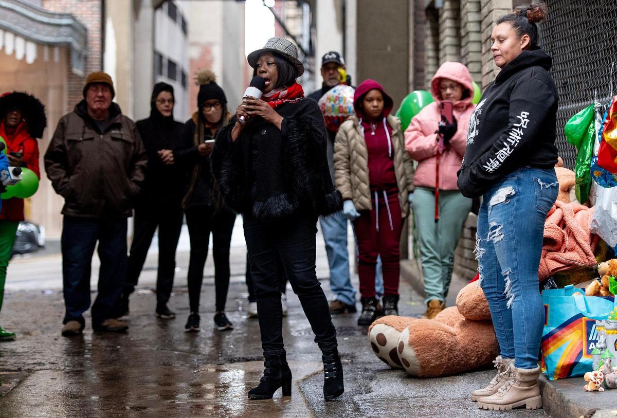Sheila Alexander sings during a vigil for Grayson O’Connor on Wednesday, Dec. 27, 2023, in Kansas City. The 5-year-old boy was found dead in an alleyway outside of his downtown Kansas City apartment.