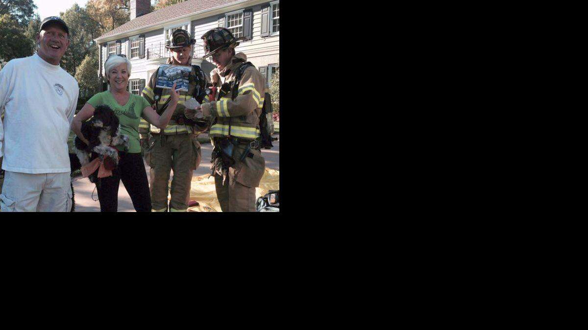 George Brett with Christine Maurer and World Series ticket-saving firefighters.