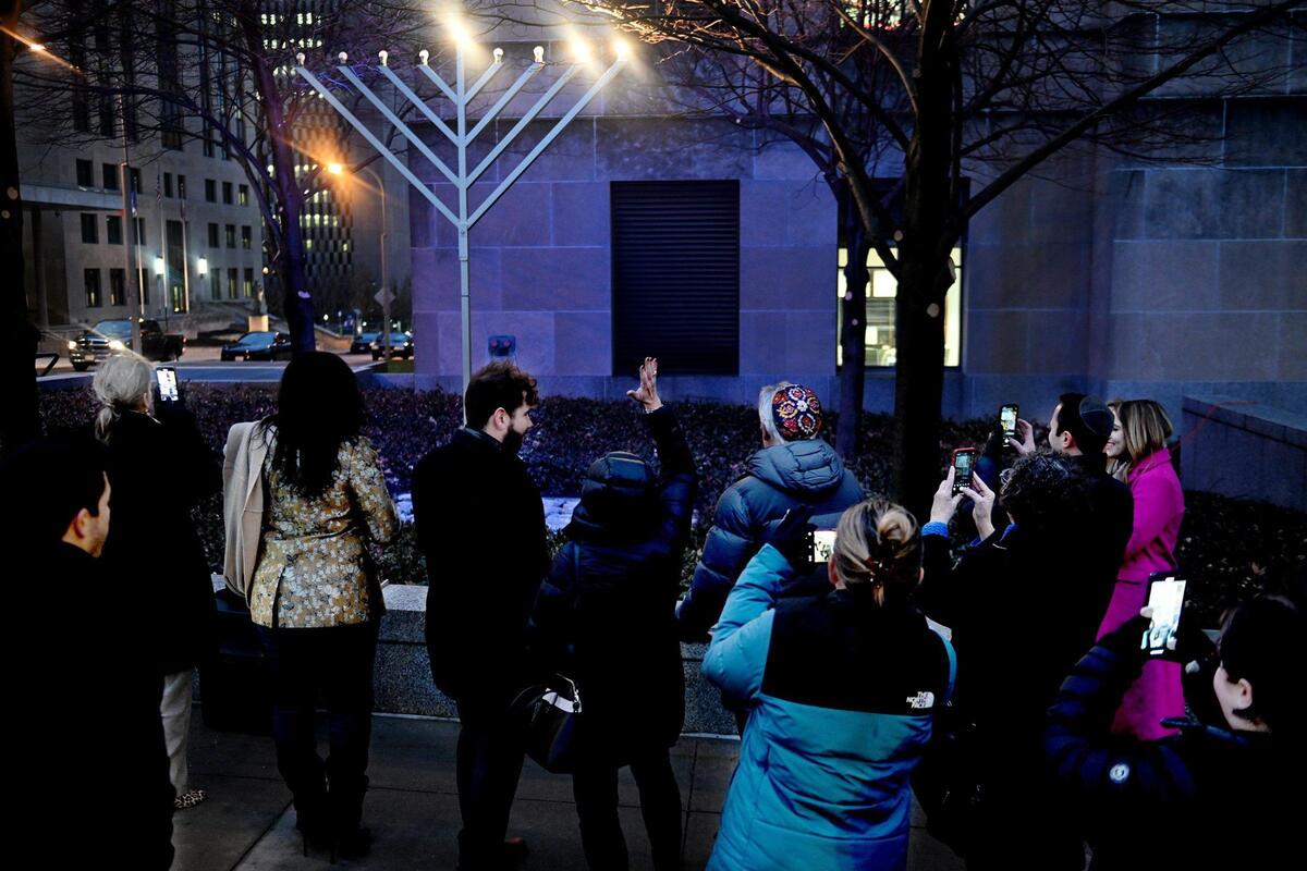 Jewish leaders celebrate the second night of Hanukkah with the lighting of a 12-foot-tall menorah outside City Hall in which Kansas City, Missouri. The group, including members of The Jewish Community Relations Bureau|American Jewish Committee and the Jewish Federation said the display of unity is a first step in combating increasing antisemitism.