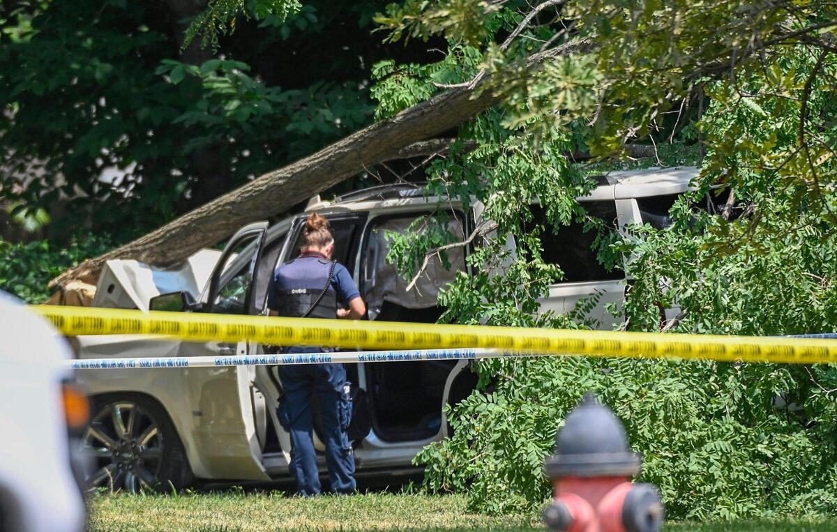 Police investigate a homicide in the 8200 block of Blue Ridge Boulevard on Saturday, July 16, 2022, in Kansas City. A man was found fatally shot in a vehicle which had crashed just off the road.