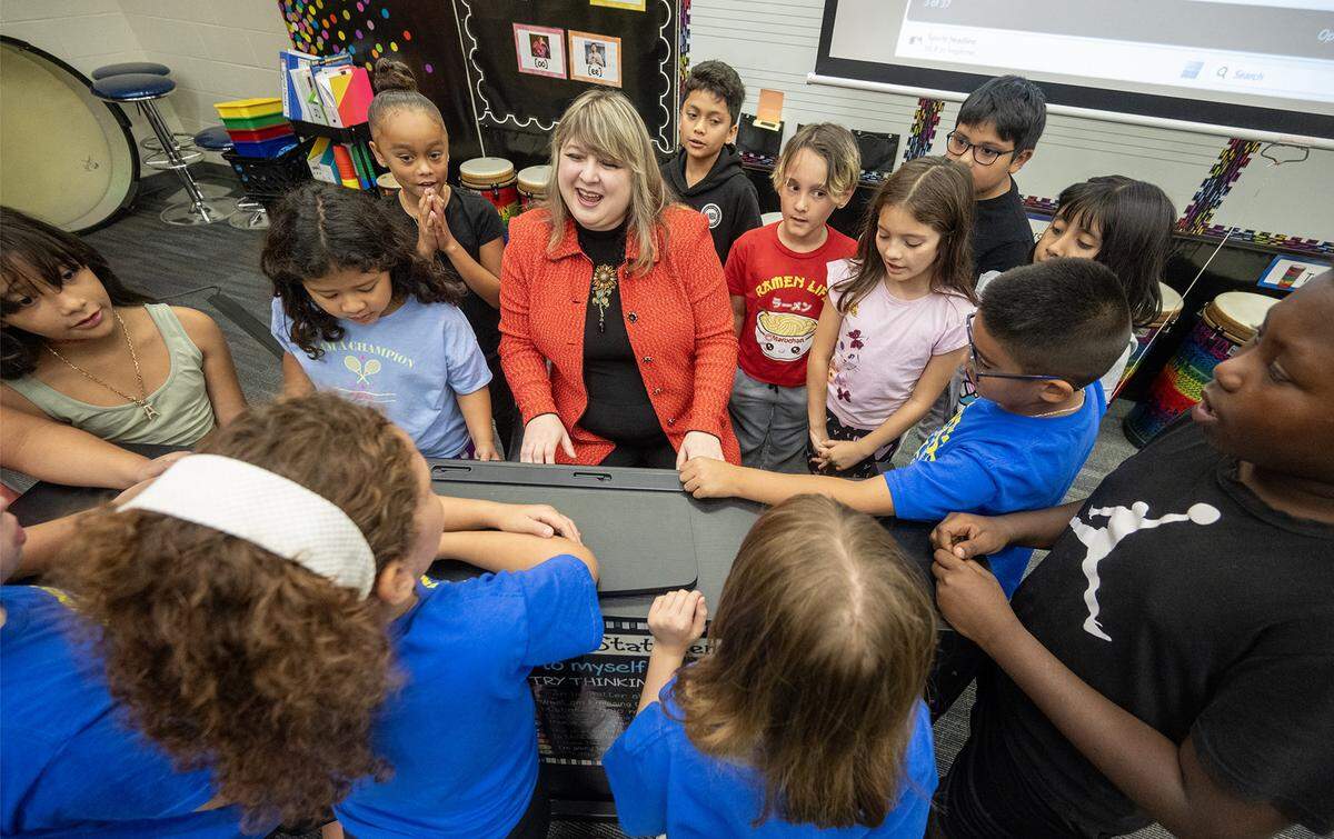 Music and special education teacher Rachel Marlow, named the 2026 Kansas Teacher of the Year, leads her third-graders in a lively rendition of ‘Autumn is Here,’ playing the piano at Central Elementary in Olathe on Wednesday, Sept. 24, 2025.