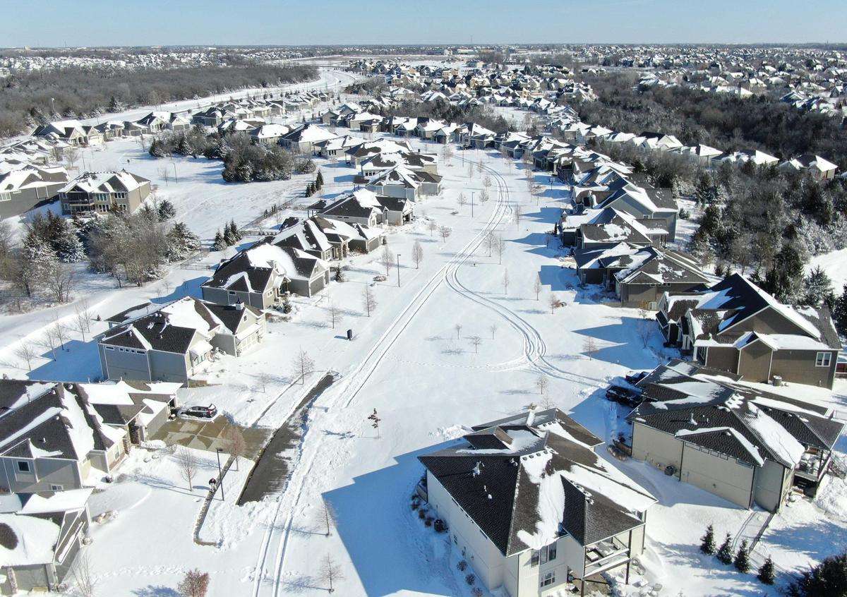 The aftermath of the blizzard could be seen Monday in the Canyon Creek Point neighborhood in western Lenexa. Located off of Wild Rose Lane and Prairie Star Parkway, the area was blanketed in about 11 inches of snow.