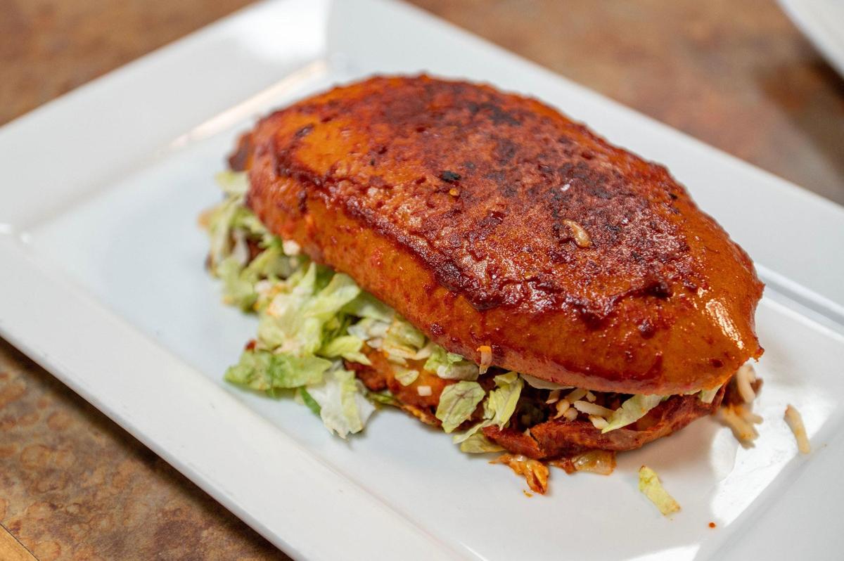 The Corner Mexican Food’s vegan pambazo includes potato, soy chorizo and mozzarella cheese and is coated in a house-made red chili sauce.