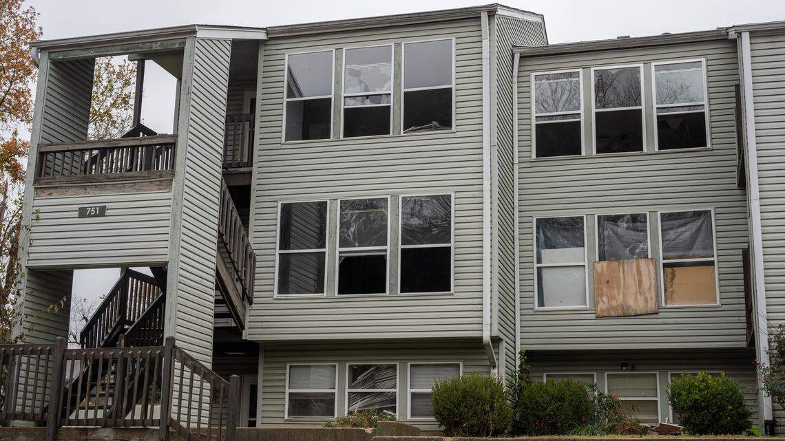 Broken and boarded-up windows are seen at Olive Park Village Apartments on Friday, Nov. 21, 2025, in Kansas City.