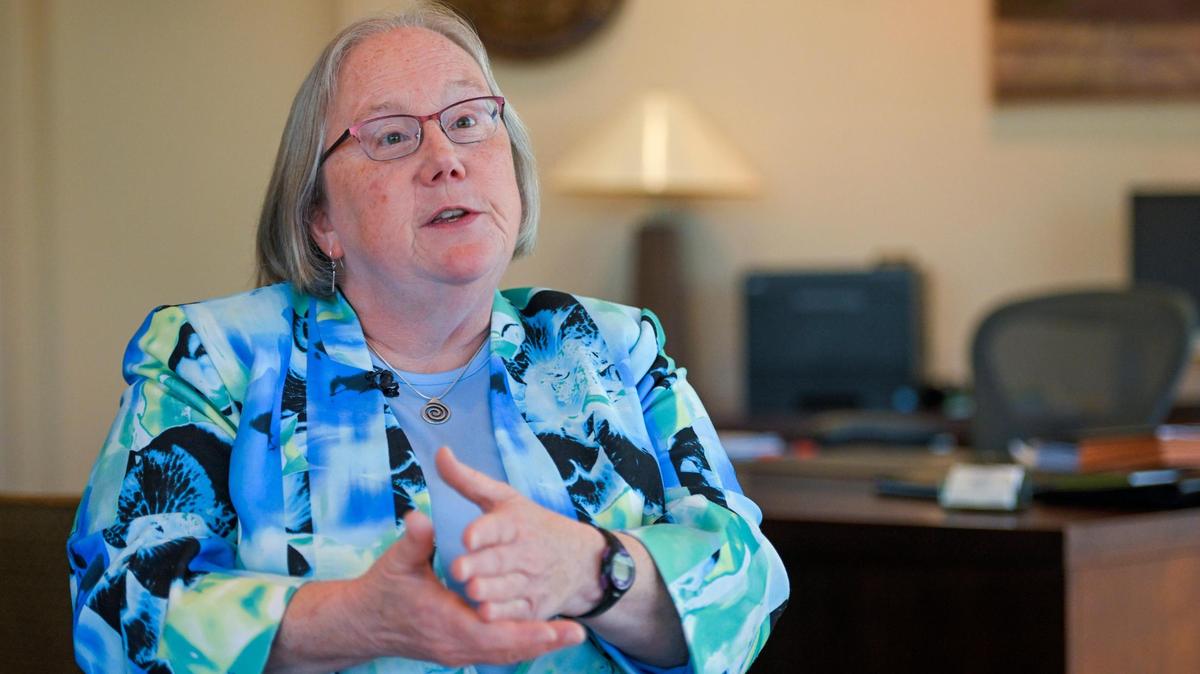 Secretary Laura Howard of the Kansas Department for Children and Families talks with a guest in her office on Wednesday, Aug. 31, 2022, in Topeka, Kansas.