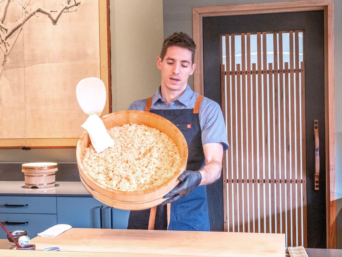 Chef Karson Thompson shows off the freshly made rice that forms the foundation of his nigiri dishes. “I’m not the star of the show,” he said. “This rice is.”