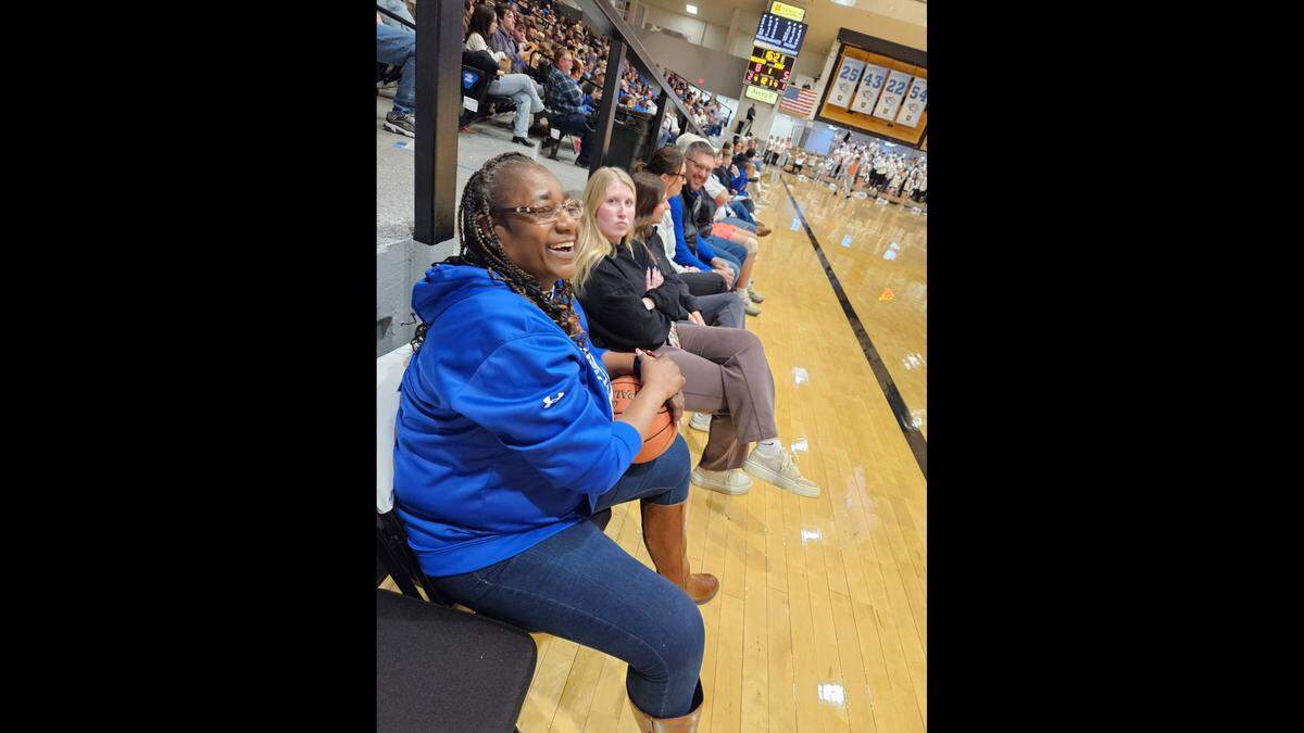 Marvies “Nette” Garrett is seen at a Dakota Wesleyan University basketball game in a submitted photo. Garrett is remembered by family as a proud basketball mom.