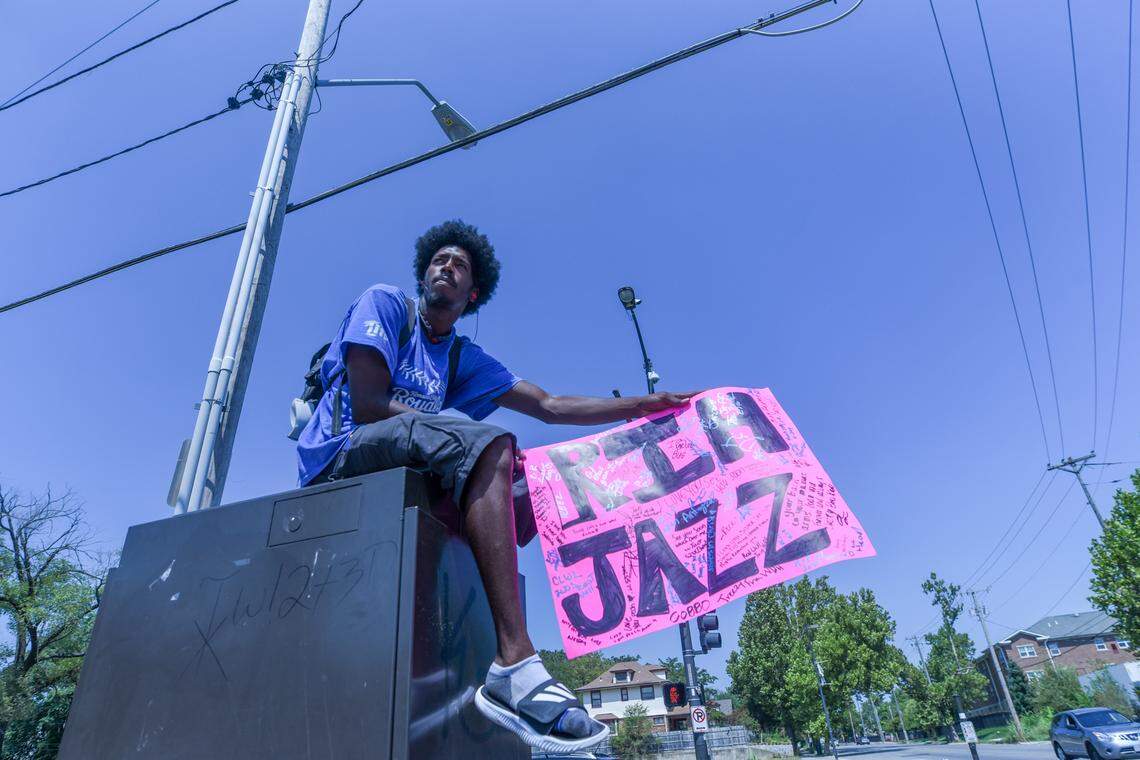 Anti-violence activist Troy Robertson is pictured in August 2020 holding a “Rest in Heaven” sign in memory of a gun violence victim at the intersection of 35th Street and Prospect Avenue in Kansas City. Robertson has reported being beaten and mistreated by police several times over the past five years.