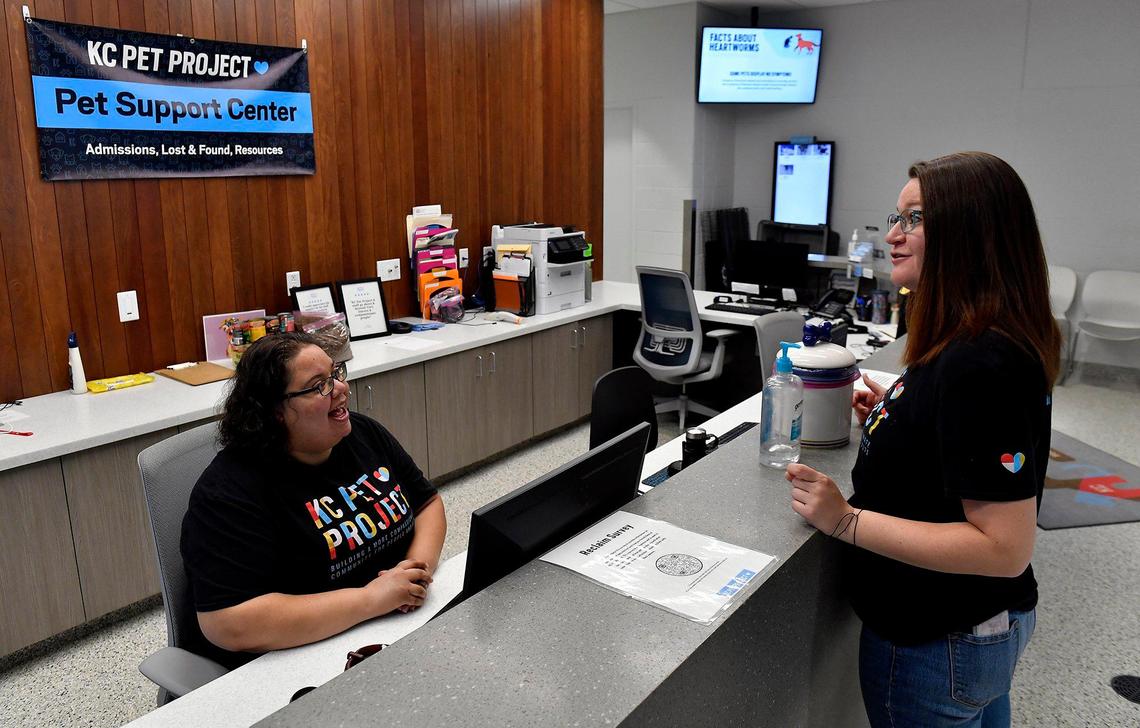 Natalie Howard, right, one of KC Pet Project’s case managers, checks in with Tara McNamara, a pet support specialist at KC Pet Project.