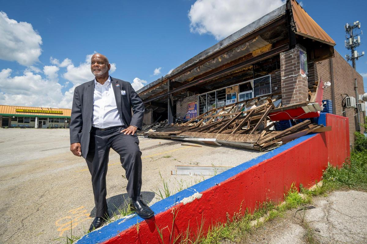 Darrell Curls, Council member of the 5th District at Large, stands at vacant and partially burned out Robandee Shopping Center, 8300 E. Bannister Road, on Monday, July 7, 2025, in Kansas City. Curls would like to see the commercial strip mall demolished and the site repurposed for the betterment of the neighborhood.