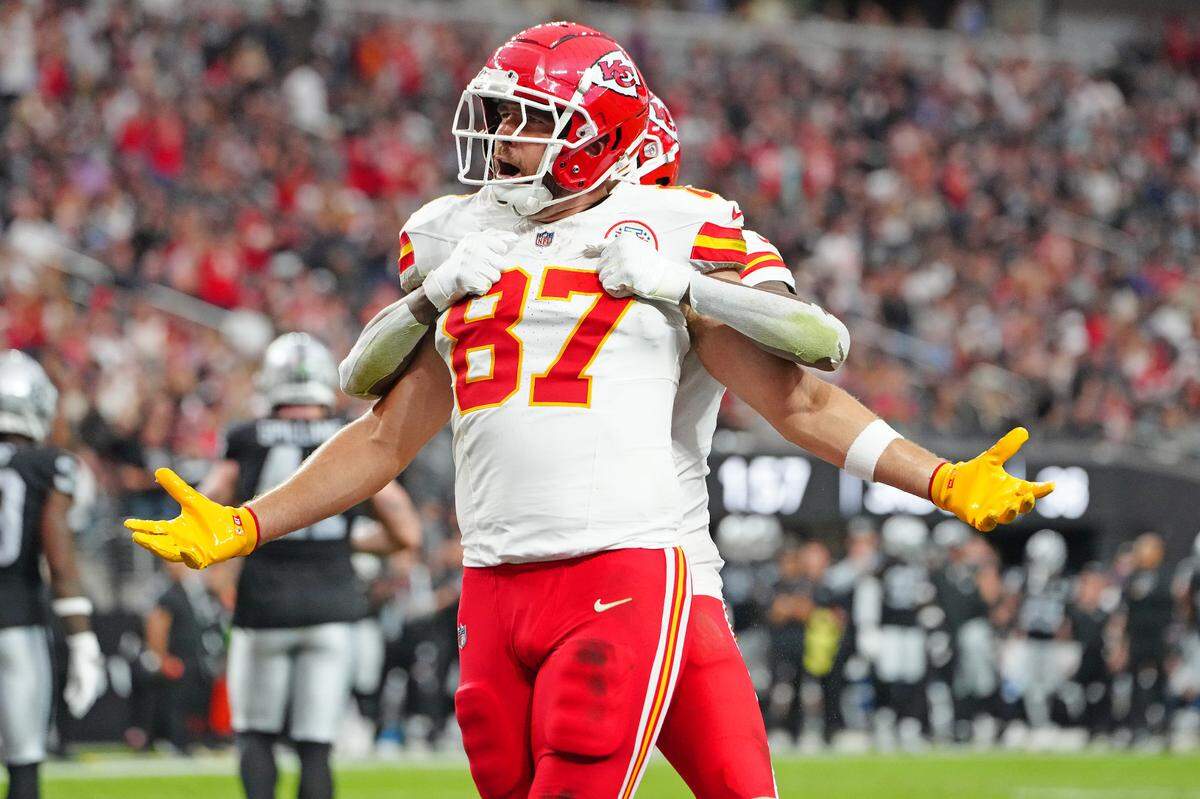 Kansas City Chiefs tight end Travis Kelce (No. 87) celebrates his TD catch from Patrick Mahomes with wide receiver DeAndre Hopkins during a Sunday, Oct. 27, 2024 NFL Week 8 game against the Las Vegas Raiders at Allegiant Stadium in Paradise, Nevada.