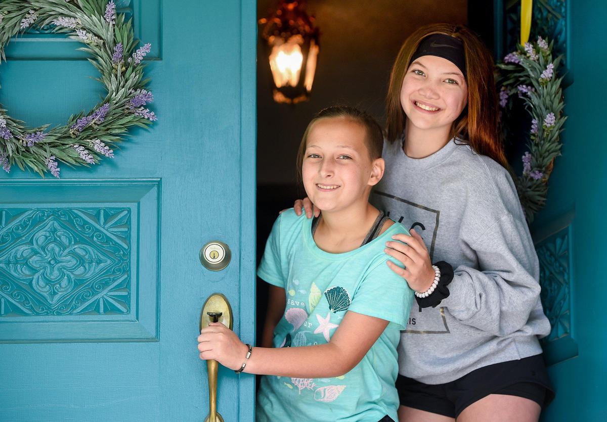 Georgia Graves, 11, and her sister, Hazel Graves,13, of Lee’s Summit, Missouri, said they’ve become closer during their quarantine time together at home in Lee’s Summit.
