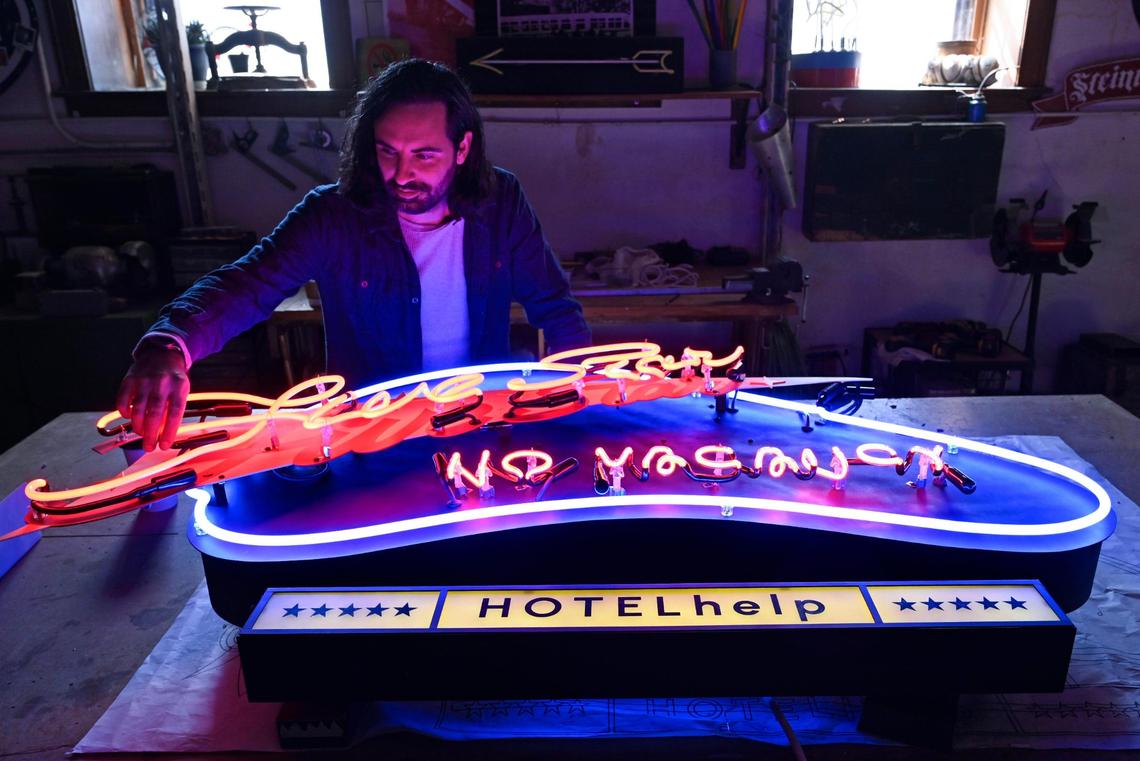 Dylan Steinmetz designs and makes custom neon signs, including this piece for a hospitality-industry client, at Element Ten, a Kansas City neon studio he co-owns.