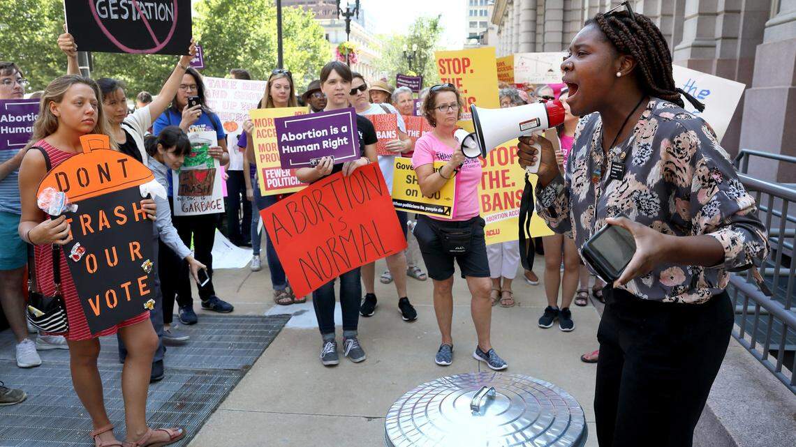 Missouri State Rep. LaKeySha Bosley, right, addresses the crowd during a protest outside the St. Louis office of Missouri Secretary of State Jay Ashcroft. Abortion-rights activists are upset Ashcroft delayed issuing ballot language needed to start collecting signatures on a referendum that would force a public vote on a new Missouri law that bans abortions at eight weeks of pregnancy or later.