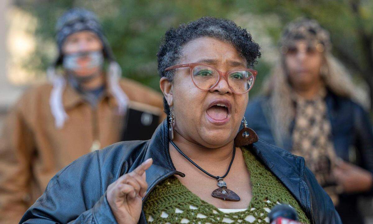 Sheryl Ferguson, an organizer with It’s Time 4 Justice, speaks to the media outside the Jackson County Court House in Kansas City Wednesday, Nov. 3, 2021, to demand the recusal of a Jackson County judge who will preside over criminal trial of former Kansas City police officer Eric Delvakaneare, who was indicted last year on charges of first-degree involuntary manslaughter and armed criminal action in the Dec. 3, 2019, killing of 26-year-old Cameron Lamb. The trial is set to begin Monday at the courthouse in Kansas City.