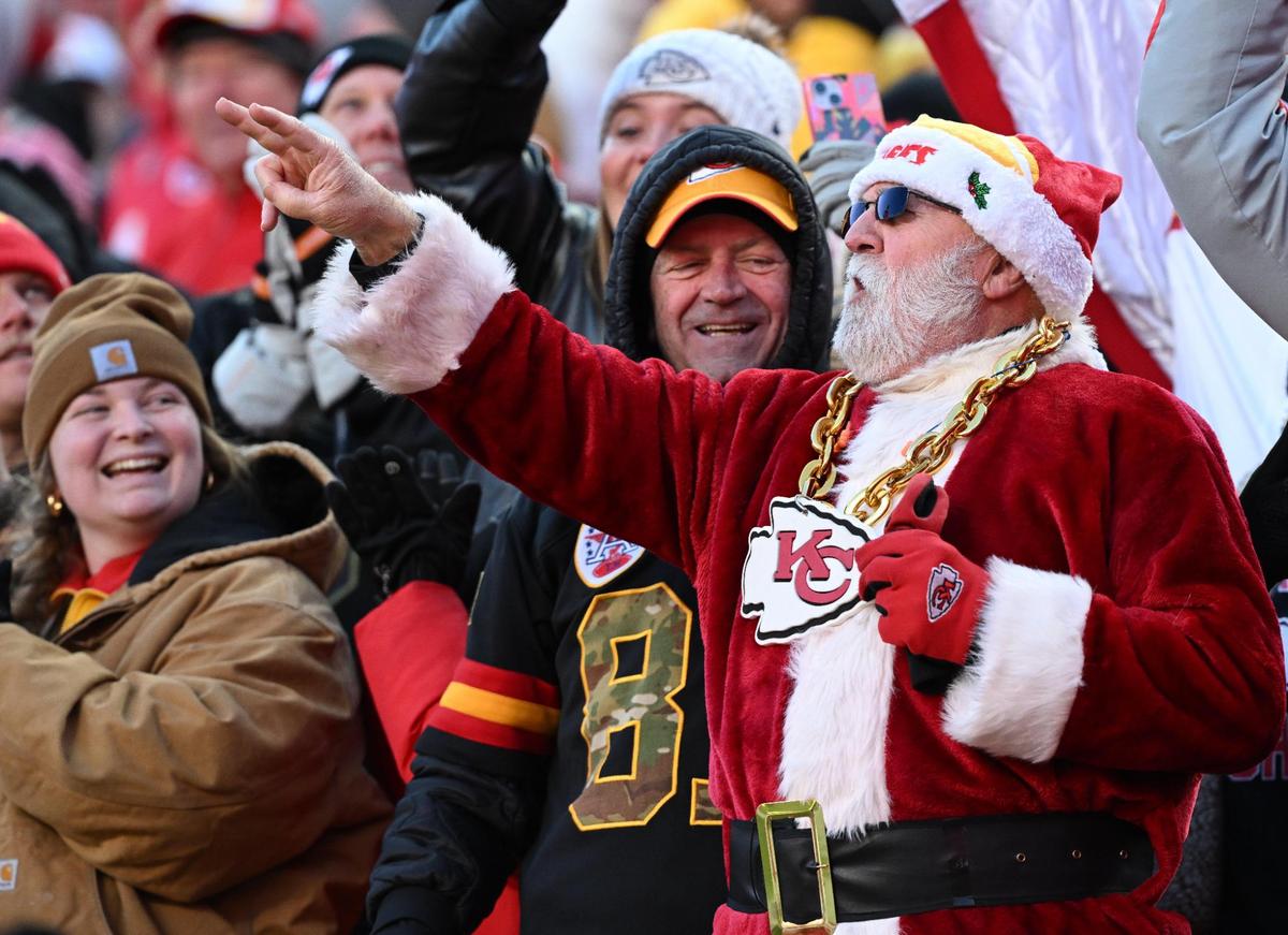 A fan dressed as Santa Claus cheers on the Kansas City Chiefs while they play the Houston Texans on Saturday, Dec. 21, 2024, at GEHA Field at Arrowhead Stadium.