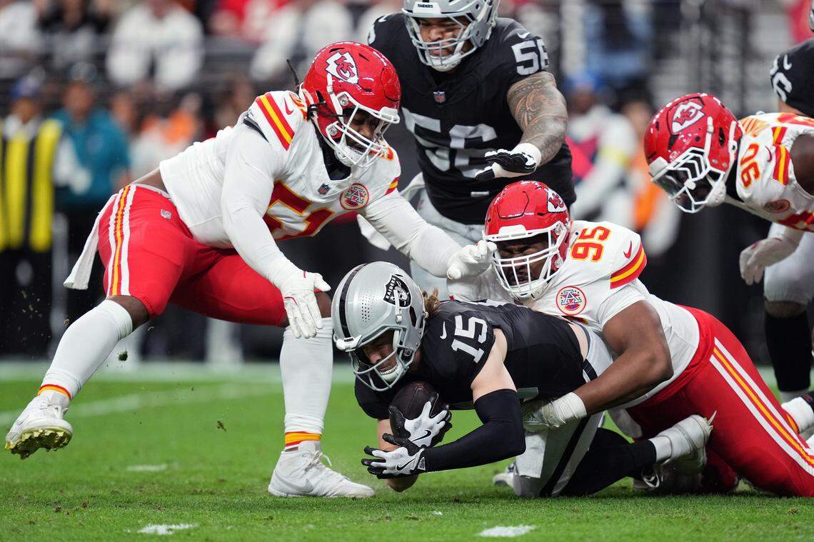 Raiders quarterback Kenny Pickett (No. 15) is sacked by Kansas Chiefs defensive lineman Chris Jones (No. 95) during an NFL Week 18 game at Allegiant Stadum in Las Vegas on Sunday, Jan. 4, 2026.