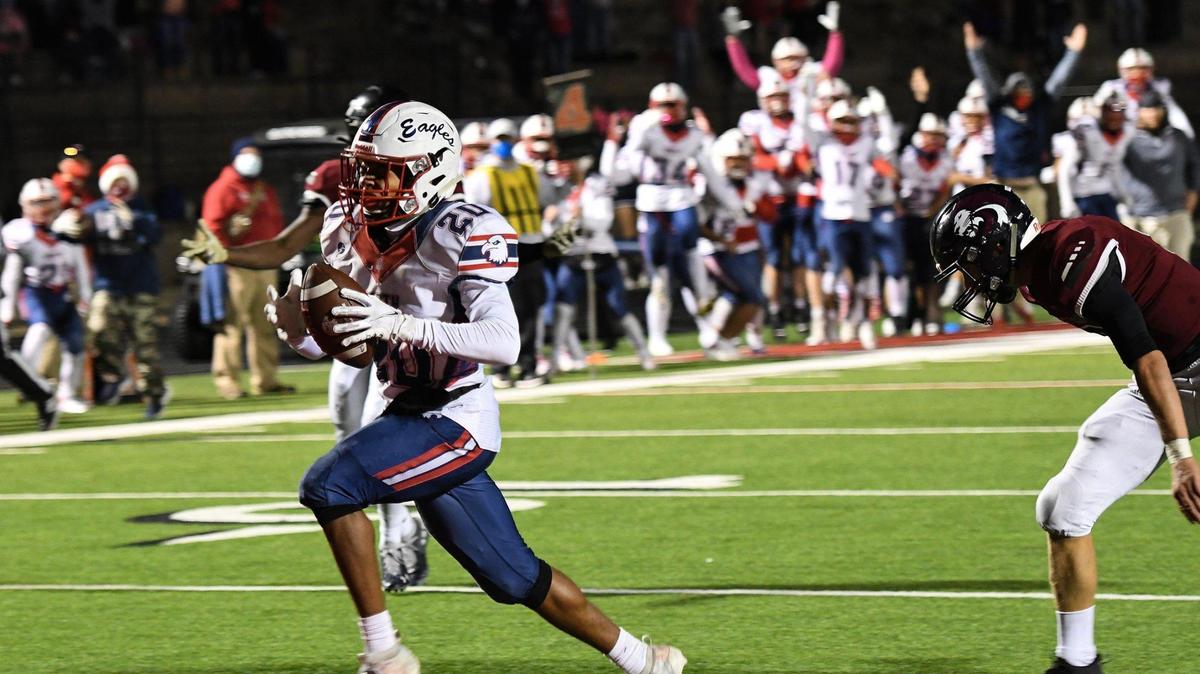 Olathe North senior Laython Patillo scores a touchdown in the fourth quarter at Lawrence on Friday, Oct. 16, 2020. Lawrence defeated Olathe North 21-20.