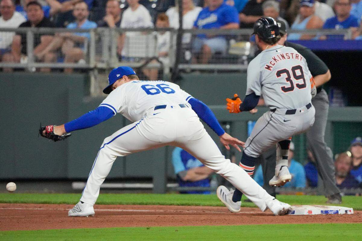 Detroit Tigers third baseman Zach McKinstry (39) reaches first base safely as Kansas City Royals relief pitcher James McArthur (66) mis-plays the throw at Kauffman Stadium on Sep 16, 2024 in Kansas City, Missouri, USA.