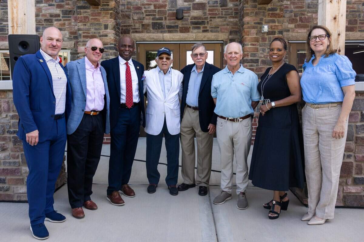 St. Michael's leadership and project partners stand outside the entrance to Valor House at St. Michael's Veterans Center on Monday, June 29, 2026. Valor House, the final residential building in St. Michael's Veterans Center's original campus master plan, adds 62 affordable apartment homes, expanding the campus to 179 permanent housing units for veterans experiencing homelessness or disabilities in the Kansas City area.