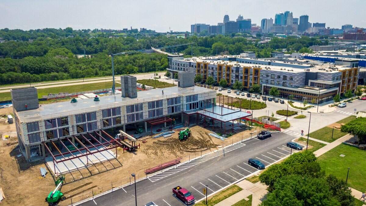 Origin KC, left, a new, $30 million boutique hotel is under construction at Berkley Riverfront Park on Monday, July 17, 2023, in Kansas City. The five story hotel, which is located near the Kansas City Current’s new downtown stadium, plans to open in early 2024. Union Berkley Riverfront apartment complex is on the right.
