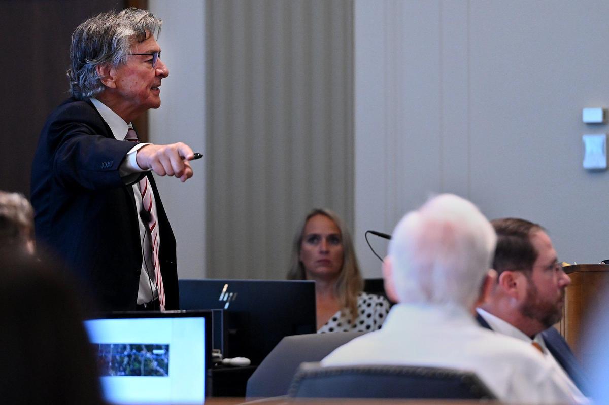 Defense attorney Daniel Ross, left, representing David G. Jungerman, seated right, gave his opening statement Tuesday. Jungerman is accused in the 2017 shooting death of attorney Tom Pickert.