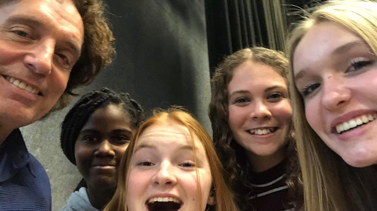 The Soul Behind the Eyes” got its start in a December 2019 workshop with composer Jim Papoulis and Olathe music students. The day included photographs with the students. Here, Papoulis, is with Olathe students (from left) Jehsa Opoka-Ahene, Molly Malicoat, Taylor Johnson, and Autumn Quarles.