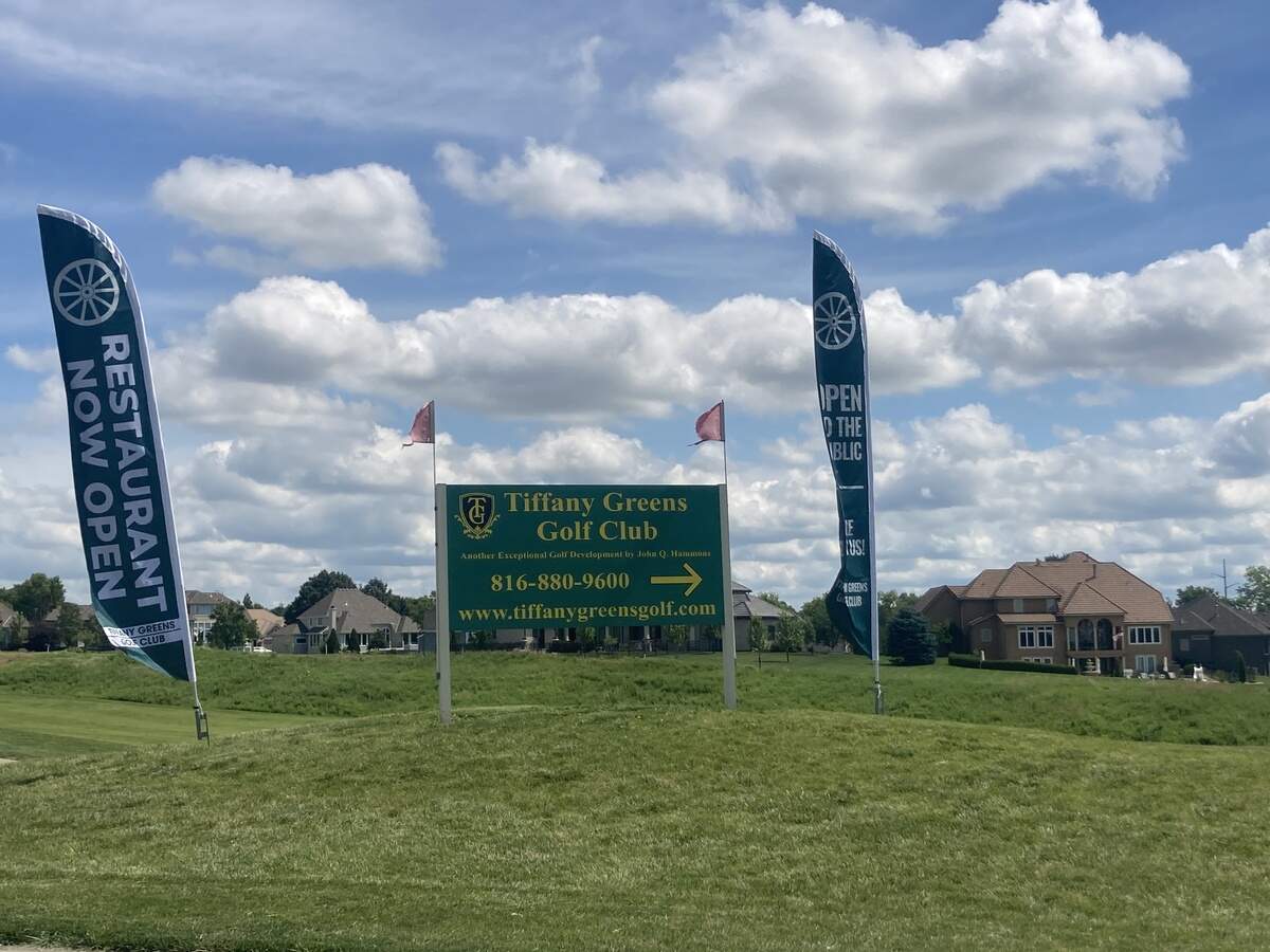 A sign directing visitors to the Tiffany Greens Golf Club, an 18-hole course founded in 1999 in Kansas City, North.