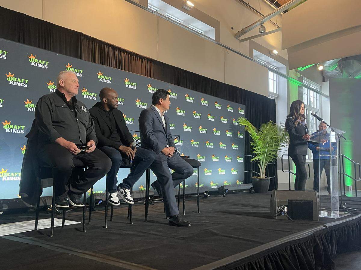 Former St. Louis Blues winger Brett Hull, former St. Louis Rams receiver Isaac Bruce and House Speaker Jonathan Patterson, a Lee’s Summit Republican, listen as Lori Kalani, DraftKings’ chief responsible gaming officer, talks about rollout of Missouri’s legal sports betting industry on Dec. 1, 2025.
