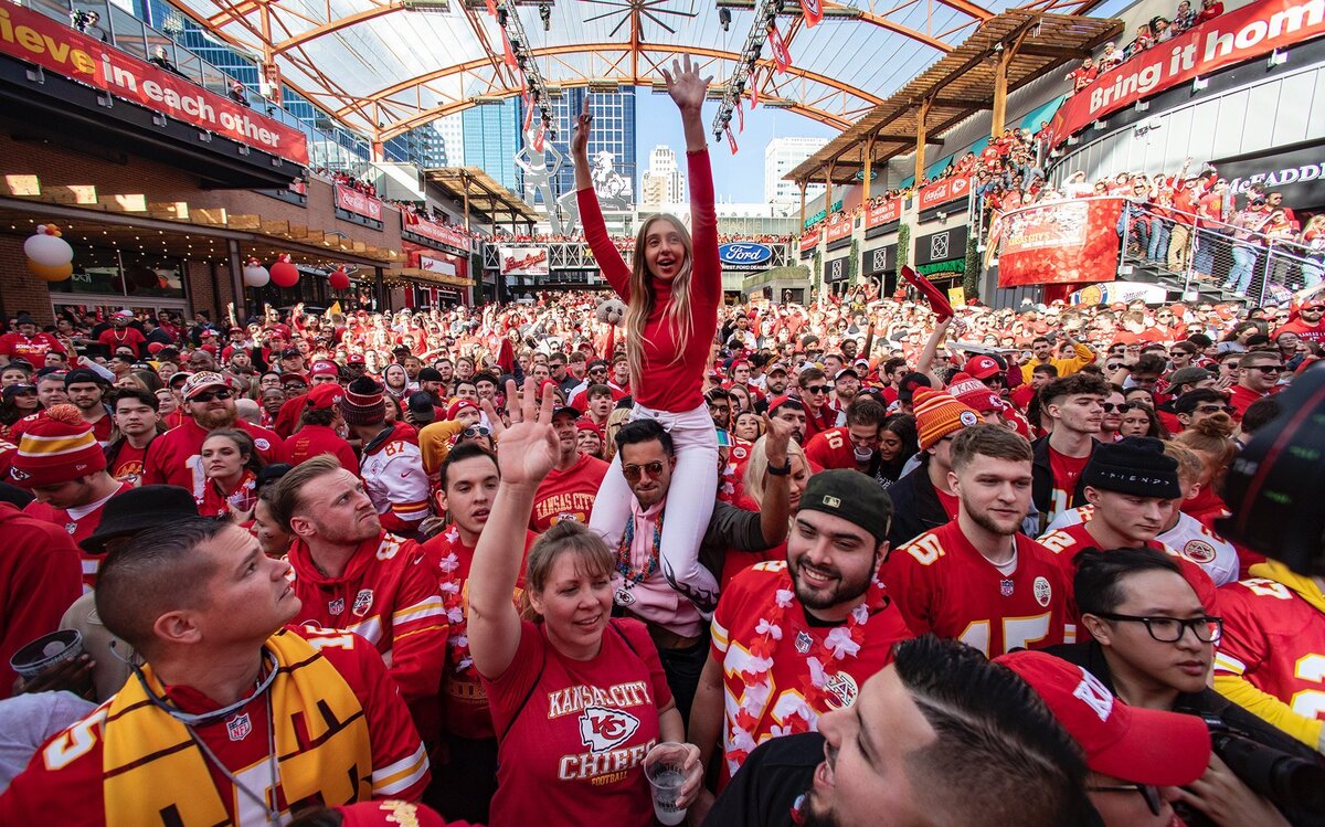 Ania Bernacik, center, was one of thousands of Kansas City Chiefs fans at the Power & Light District Sunday who were there hours early to attend a Super Bowl watch party. The crowd was there to watch the Chiefs take on the San Francisco 49ers which is being played in Miami.