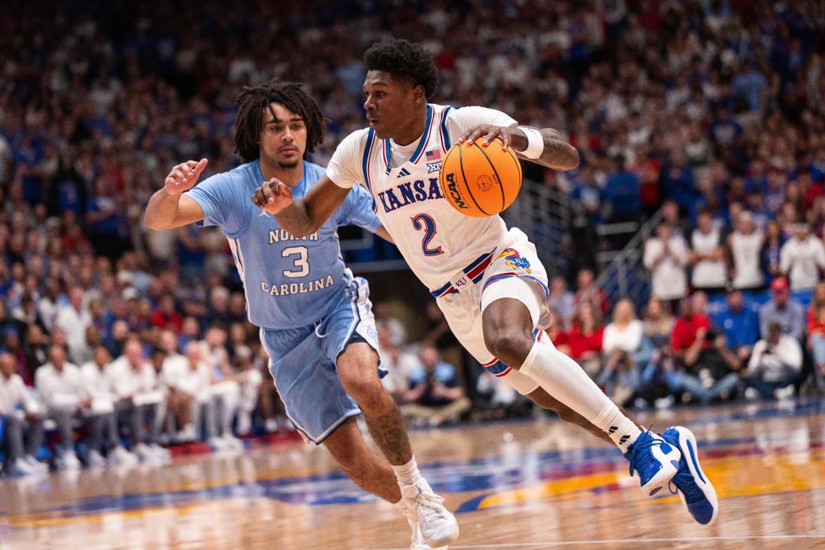 Kansas Jayhawks guard AJ Storr turns the corner on North Carolina guard Elliot Cadeau during a men’s basketball showdown at Allen Fieldhouse in Lawrence, Kan., on Friday, Nov. 8, 2024.
