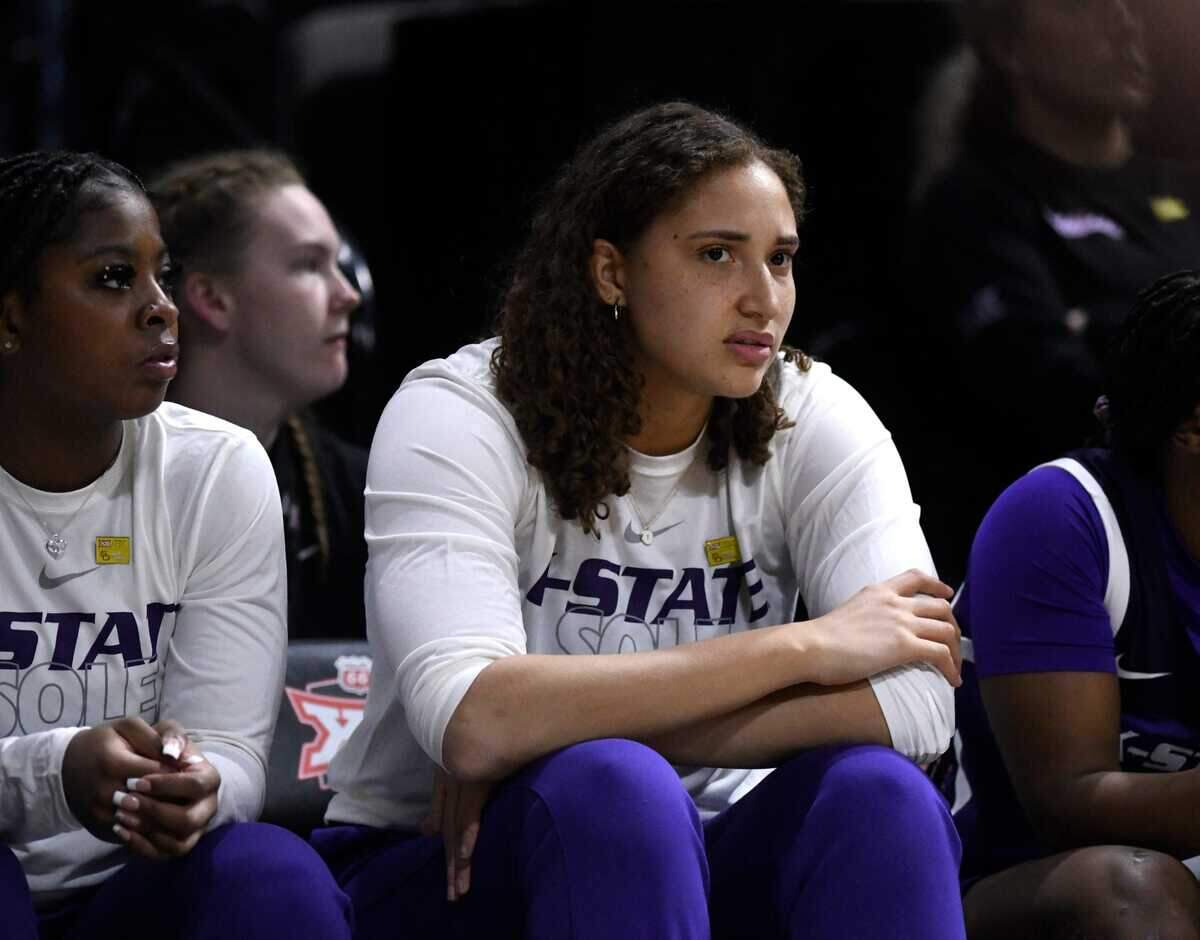 Kansas State center Ayoka Lee (50) sits on the bench during a game against Texas Tech in the first round of the Big 12 Tournament on March 9, 2023, at Kansas City’s Municipal Auditorium.