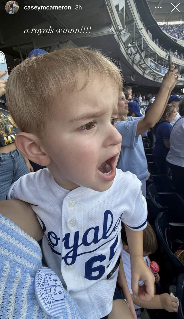 IMG_1115.jpg Auggie Cameron, son of Royals pitcher Noah Cameron, celebrated the team’s opening day win Monday with his mom, Casey Cameron.