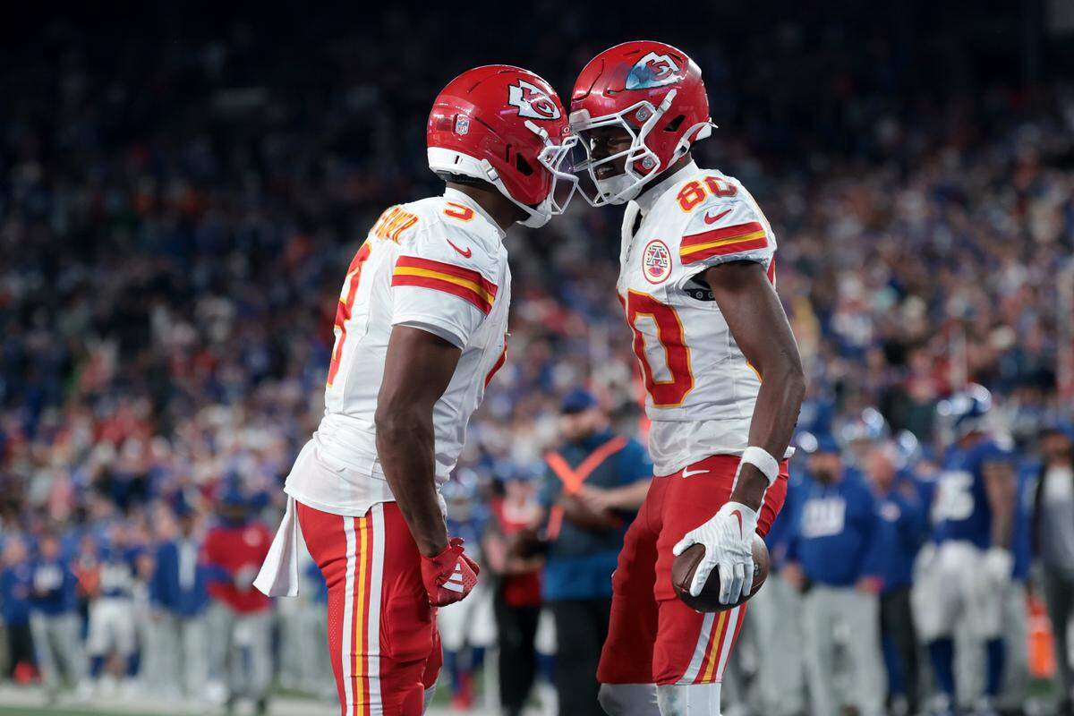 Kansas City Chiefs wide receiver Tyquan Thornton, right, is congratulated by fellow KC wideout Juju Smith-Schuster after scoring one of his two touchdowns against the New York Giants in an NFL Week 3 game at MetLife Stadium in East Rutherford, New Jersey, on Sunday, Sept. 21, 2025.