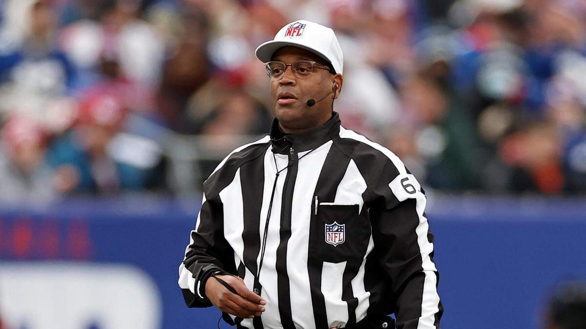 Referee Ron Torbert (62) looks on during an NFL football game between the Philadelphia Eagles and the New York Giants, Sunday, Nov. 28, 2021, in East Rutherford, N.J. (AP Photo/Adam Hunger)