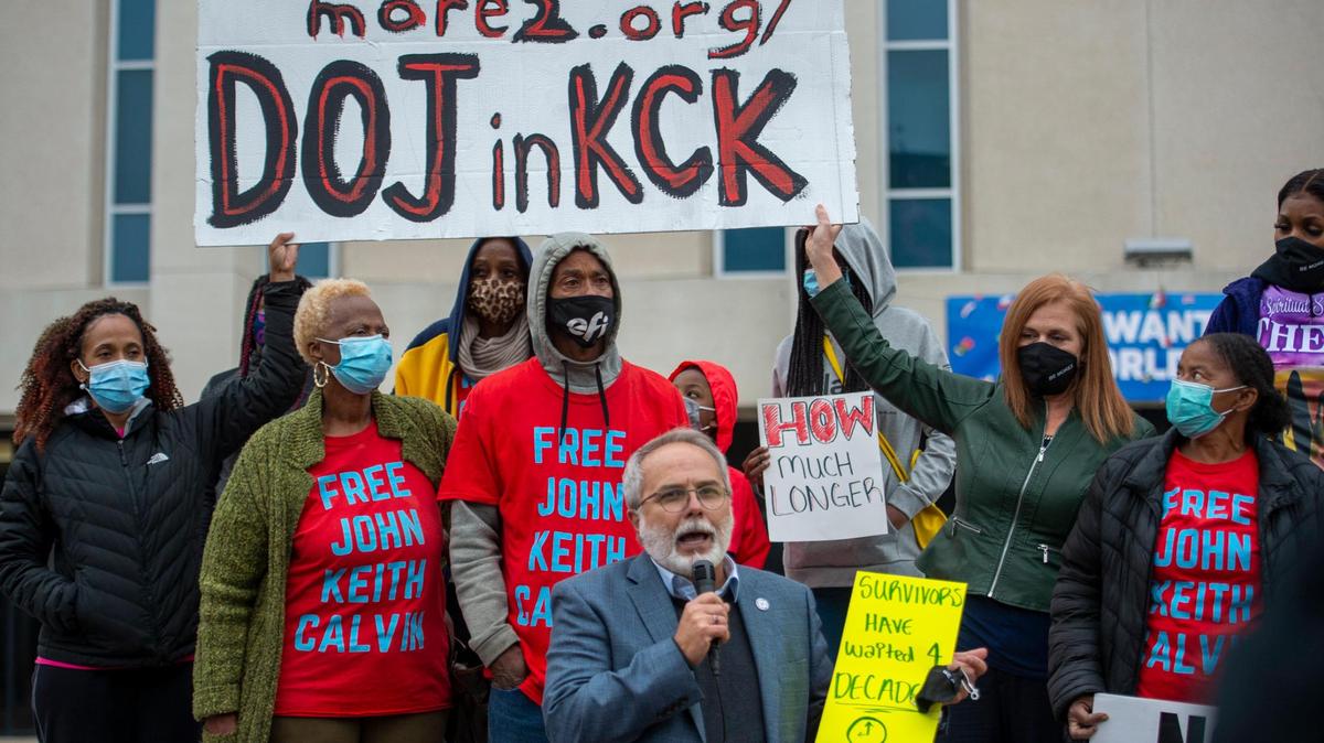 The Rev. Rick Behrens of Grandview Park Presbyterian Church of Kansas City, Kansas, spoke as victims’ family members held a sign during a rally organized by MORE2 on Monday, Oct.25, outside of the Unified Government offices to demand a Department of Justice Investigation into the abusive actions of the Kansas City, Kansas Police department.