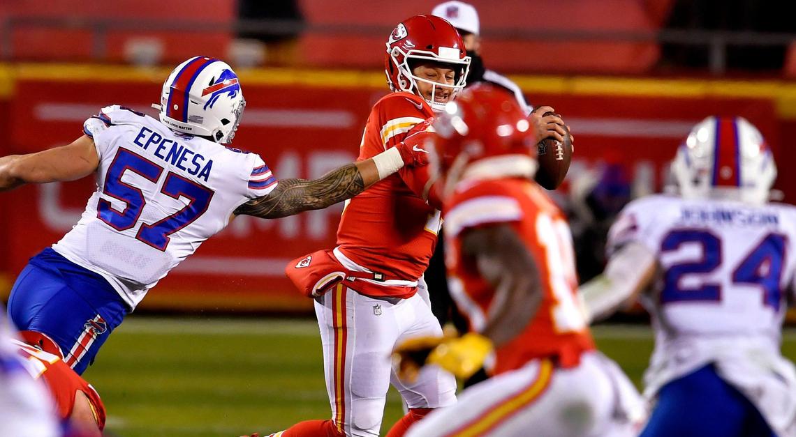 Chiefs quarterback Patrick Mahomes eludes Buffalo’s A.J. Epenesa during the first half of the AFC Championship Game Sunday at Arrowhead Stadium. Kansas City beat Buffalo, 38-24.