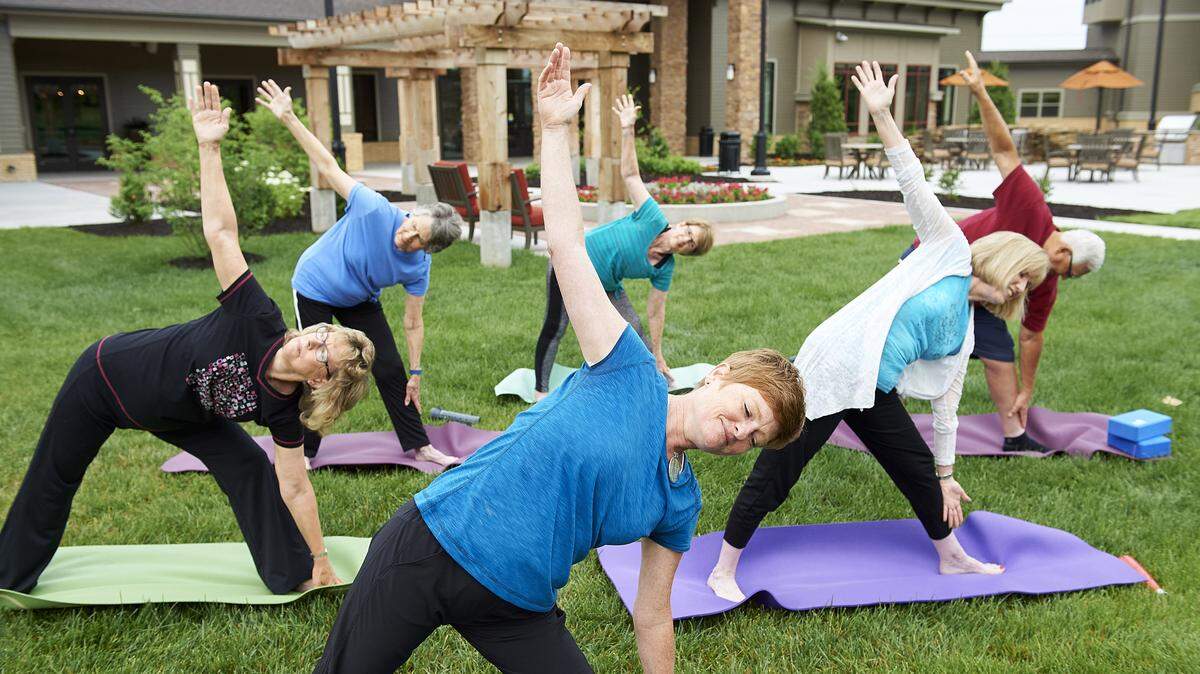 Current residents of John Knox Village take a yoga class prior to the COVID-19 crisis.