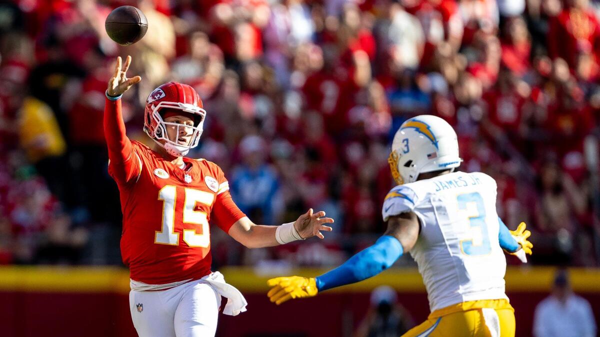 Kansas City Chiefs quarterback Patrick Mahomes (15) throws a pass over Los Angeles Chargers safety Derwin James Jr. (3) during an NFL football game at GEHA Field at Arrowhead Stadium on Sunday, Oct. 22, 2023, in Kansas City.