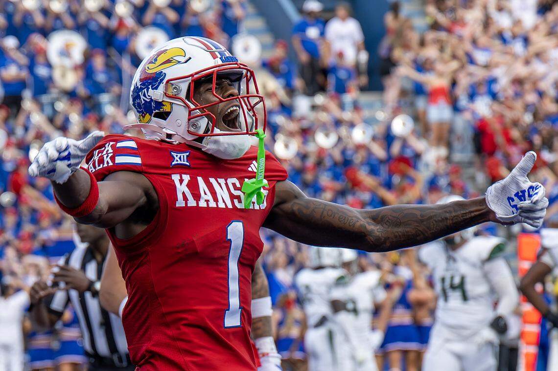 Kansas Jayhawks receiver Emmanuel Henderson Jr. (1) yells as he celebrates a touchdown during the first quarter of a game against Wagner at David Booth Kansas Memorial Stadium on Friday, Aug. 29, 2025, in Lawrence.