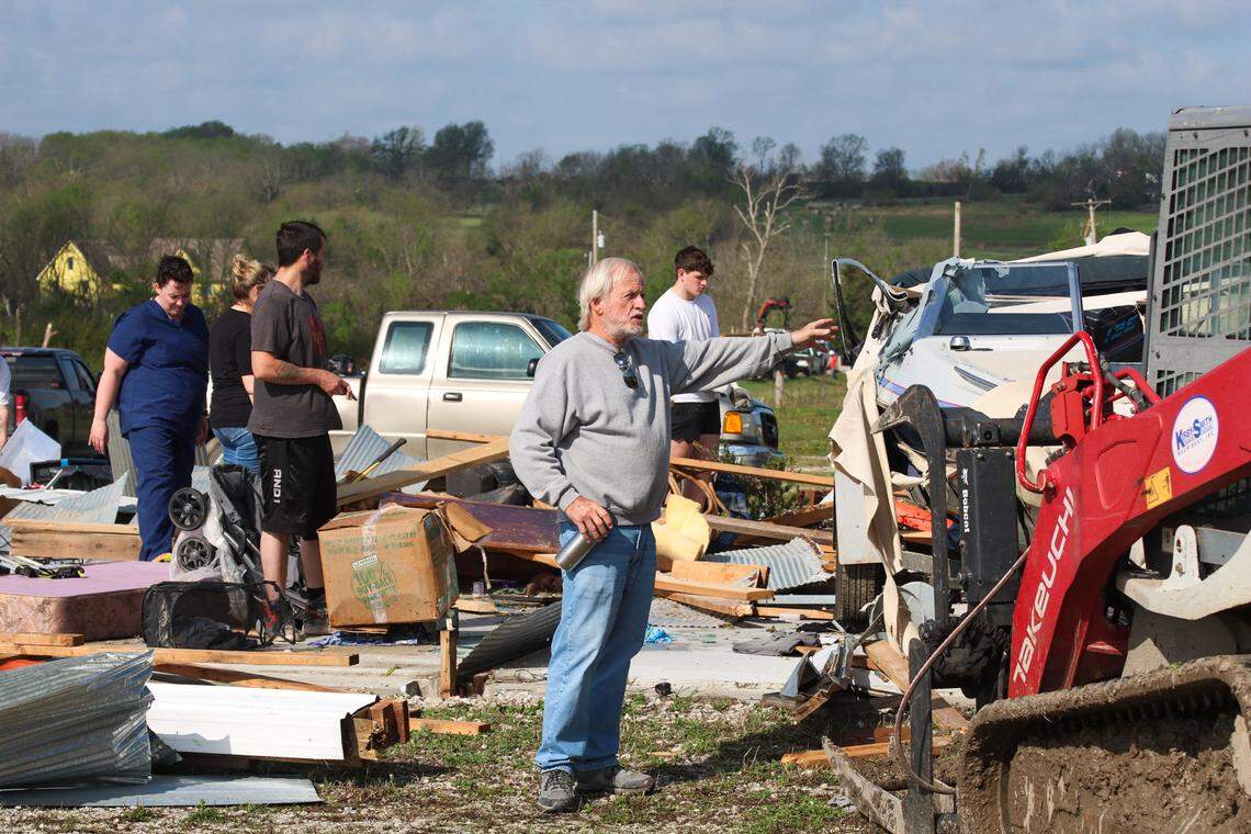 Russell Davis, owner of Hillsdale Boat & Mini Storage, looks over damage at his business on April 14, 2026 after a tornado leveled multiple storage unit buildings. Russel said he is working with people to help recover items they had in storage before another round of storms hits the area.