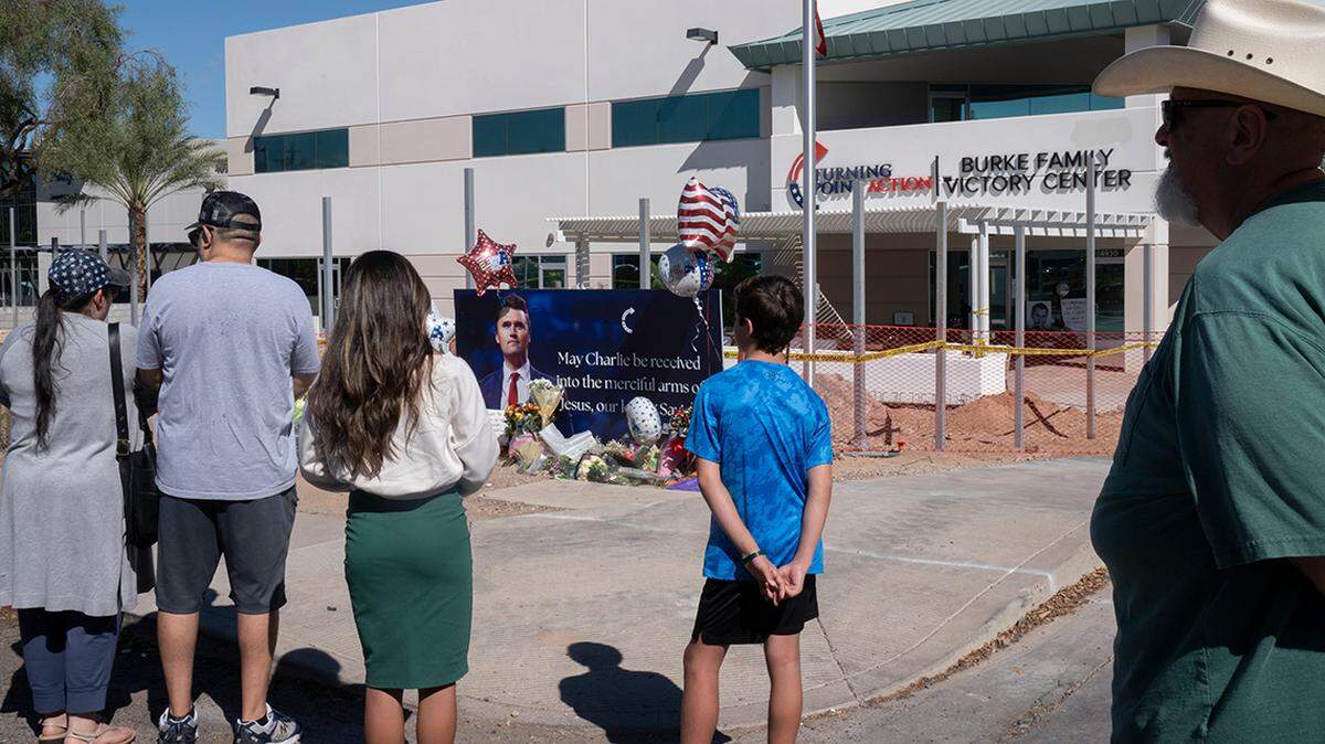 Supporters visit a memorial for Charlie Kirk at the Turning Point Headquarters in Phoenix