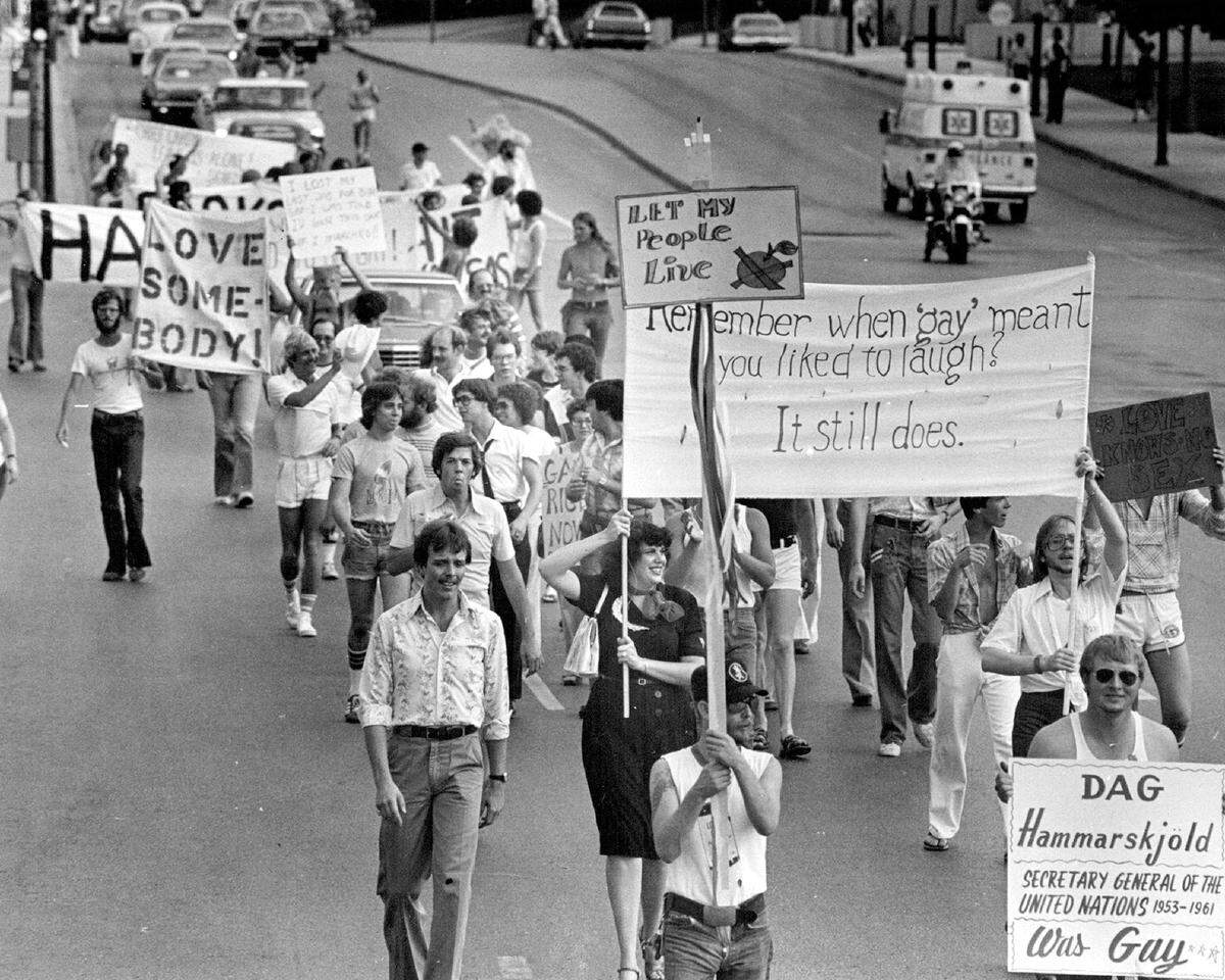 Chanting “We shall overcome,” 250 marchers walk through downtown streets in a Gay Pride Parade, the first of several functions commemo­rating Gay Pride Week June 16-24, 1978.